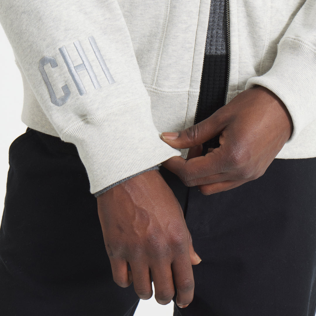 oatmeal full zip Todd Snyder New York jacket in partnership with Fanatics with vintage logo on left chest, CHI embroidered on cuff and Blackhawks wordmark on back - on figure cuff detail image