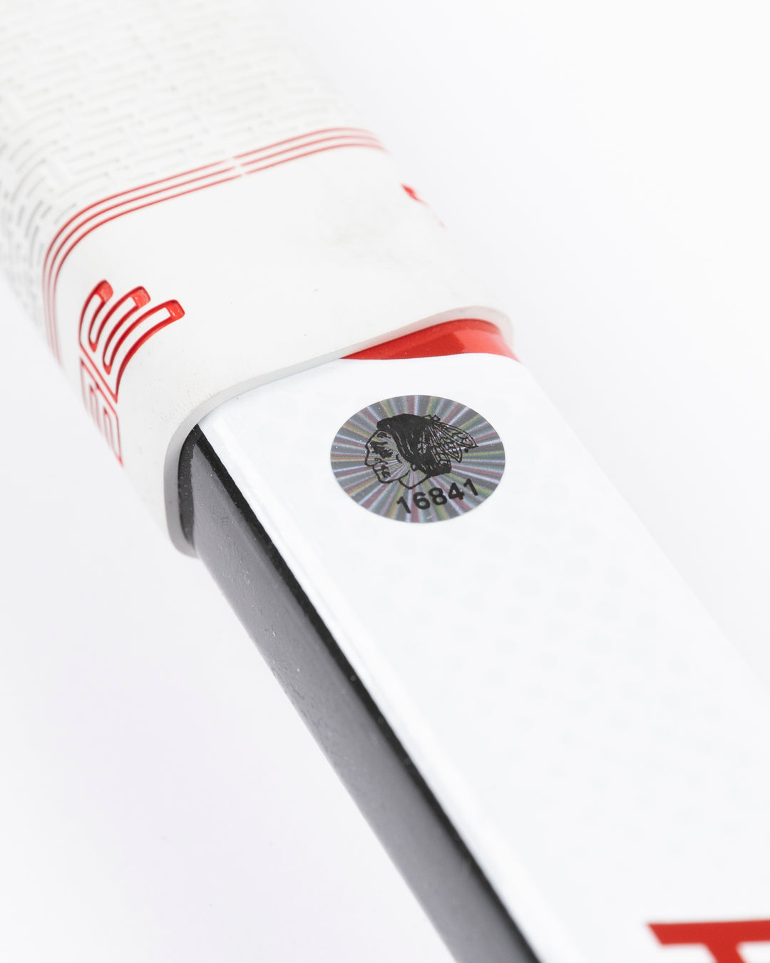 Warrior brand hockey stick used by Chicago Blackhawks goalie Petr Mrazek - hologram sticker detail lay flat