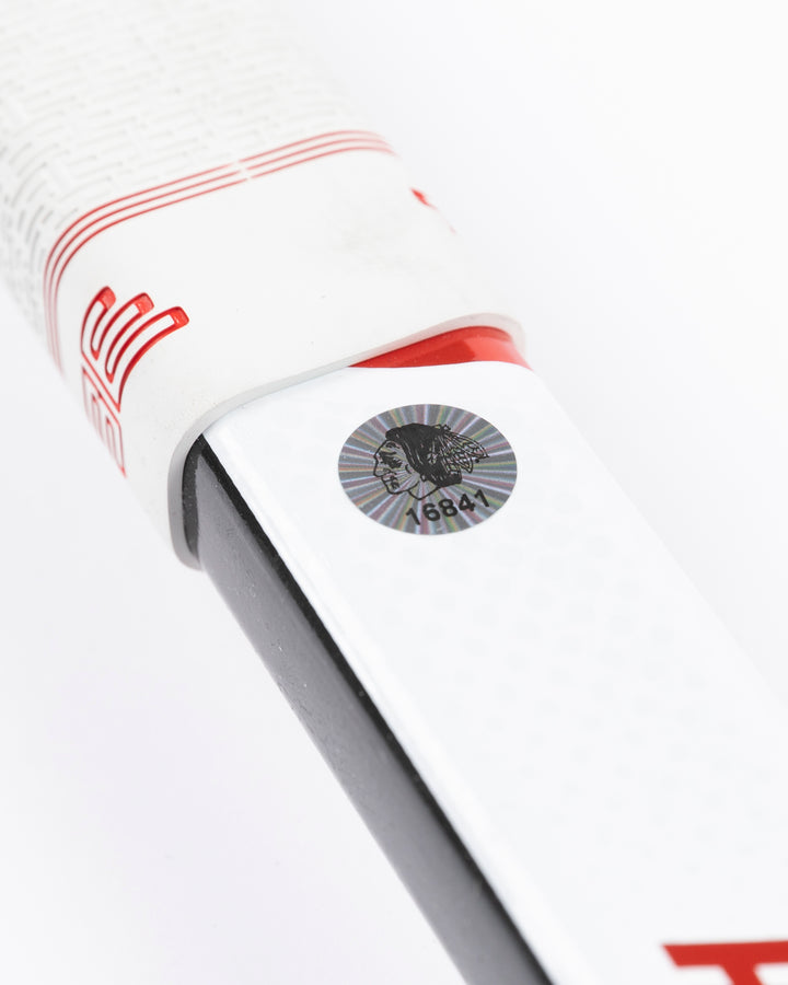 Warrior brand hockey stick used by Chicago Blackhawks goalie Petr Mrazek - hologram sticker detail lay flat