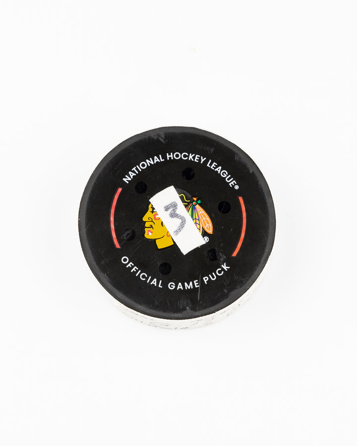 official Chicago Blackhawks game used hockey goal puck scored by player Nick Foligno against Montreal Canadiens on January 3, 2025 - front lay flat