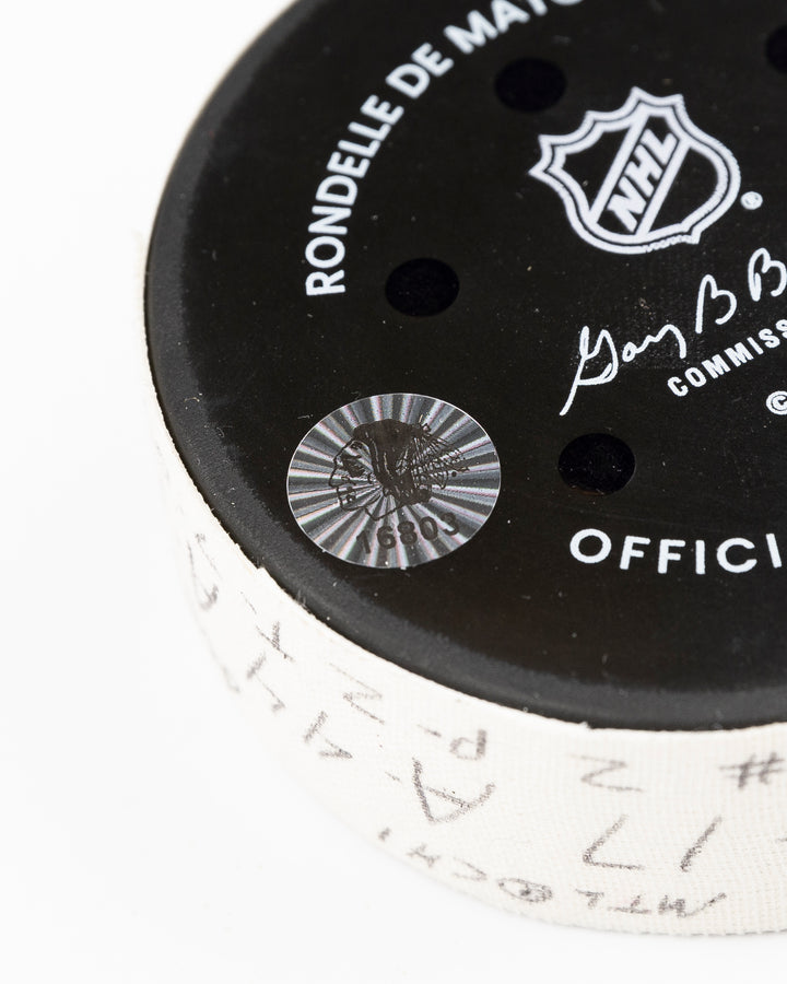 official Chicago Blackhawks game used hockey goal puck scored by player Nick Foligno against Montreal Canadiens on January 3, 2025 - hologram sticker detail lay flat