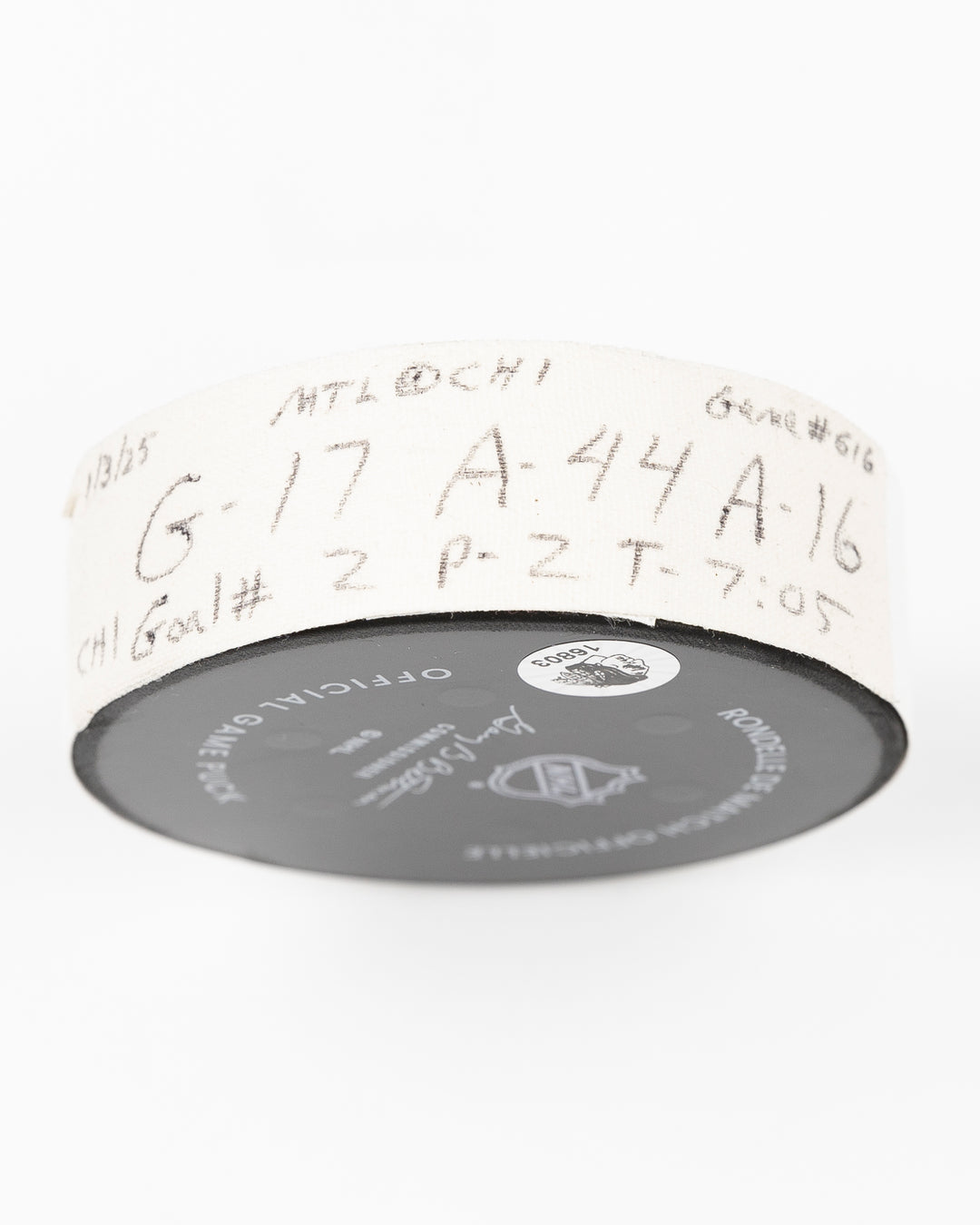 official Chicago Blackhawks game used hockey goal puck scored by player Nick Foligno against Montreal Canadiens on January 3, 2025 - tape detail lay flat