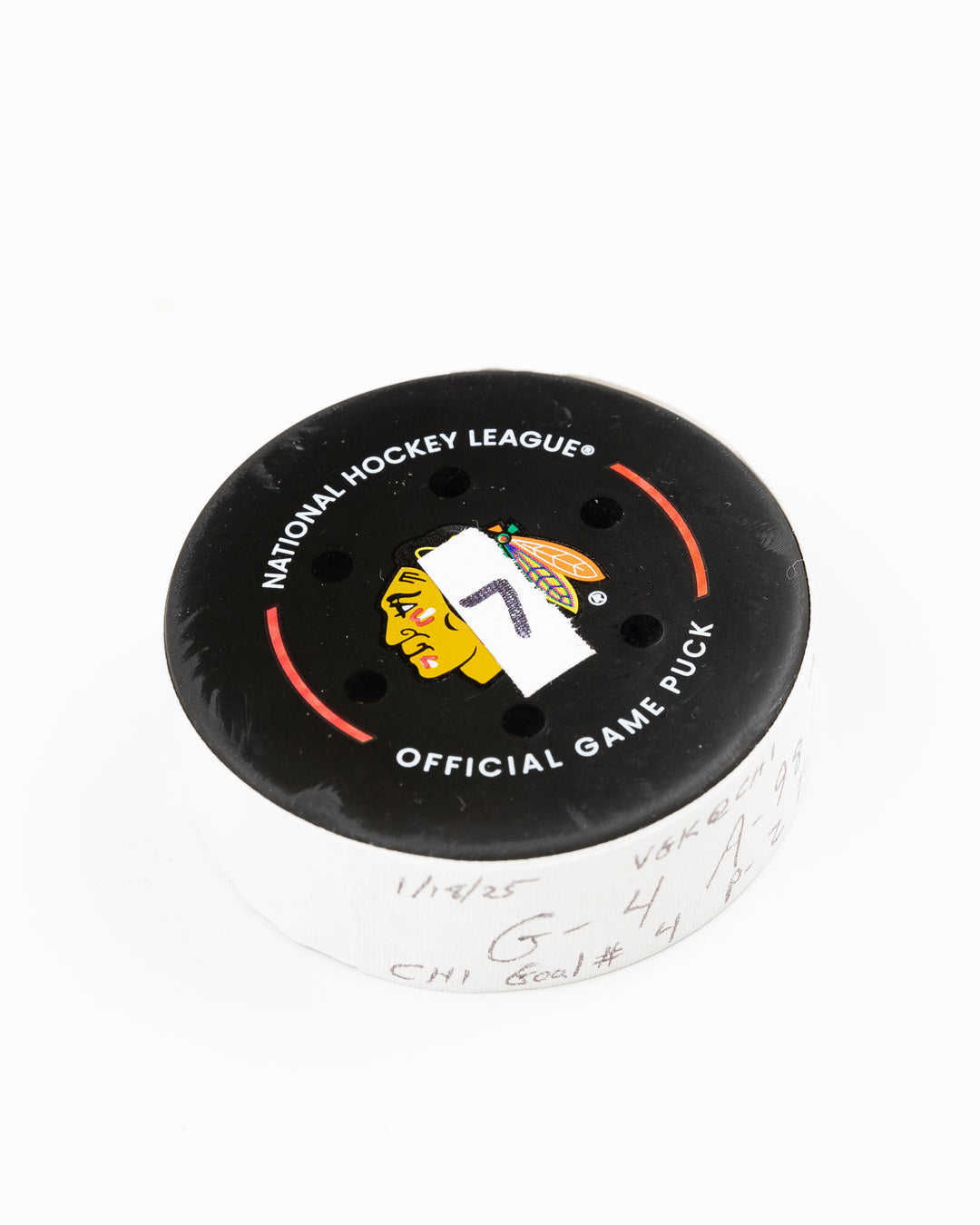 official Chicago Blackhawks game used goal hockey puck scored by Seth Jones against the Vegas Golden Knights on January 18, 2025 - front angle lay flat
