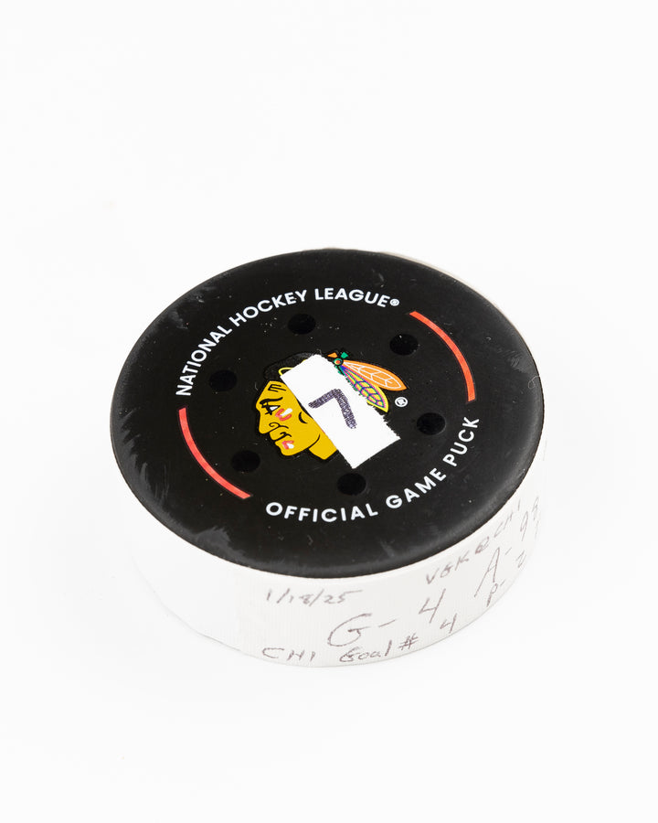 official Chicago Blackhawks game used goal hockey puck scored by Seth Jones against the Vegas Golden Knights on January 18, 2025 - front angle lay flat