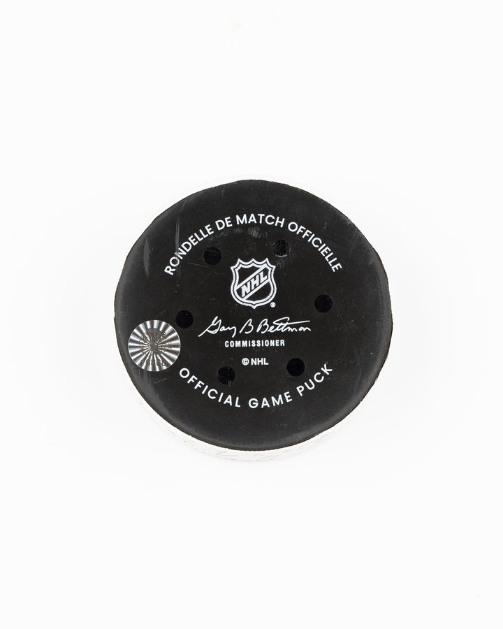 official Chicago Blackhawks game used goal hockey puck scored by Seth Jones against the Vegas Golden Knights on January 18, 2025 - back lay flat