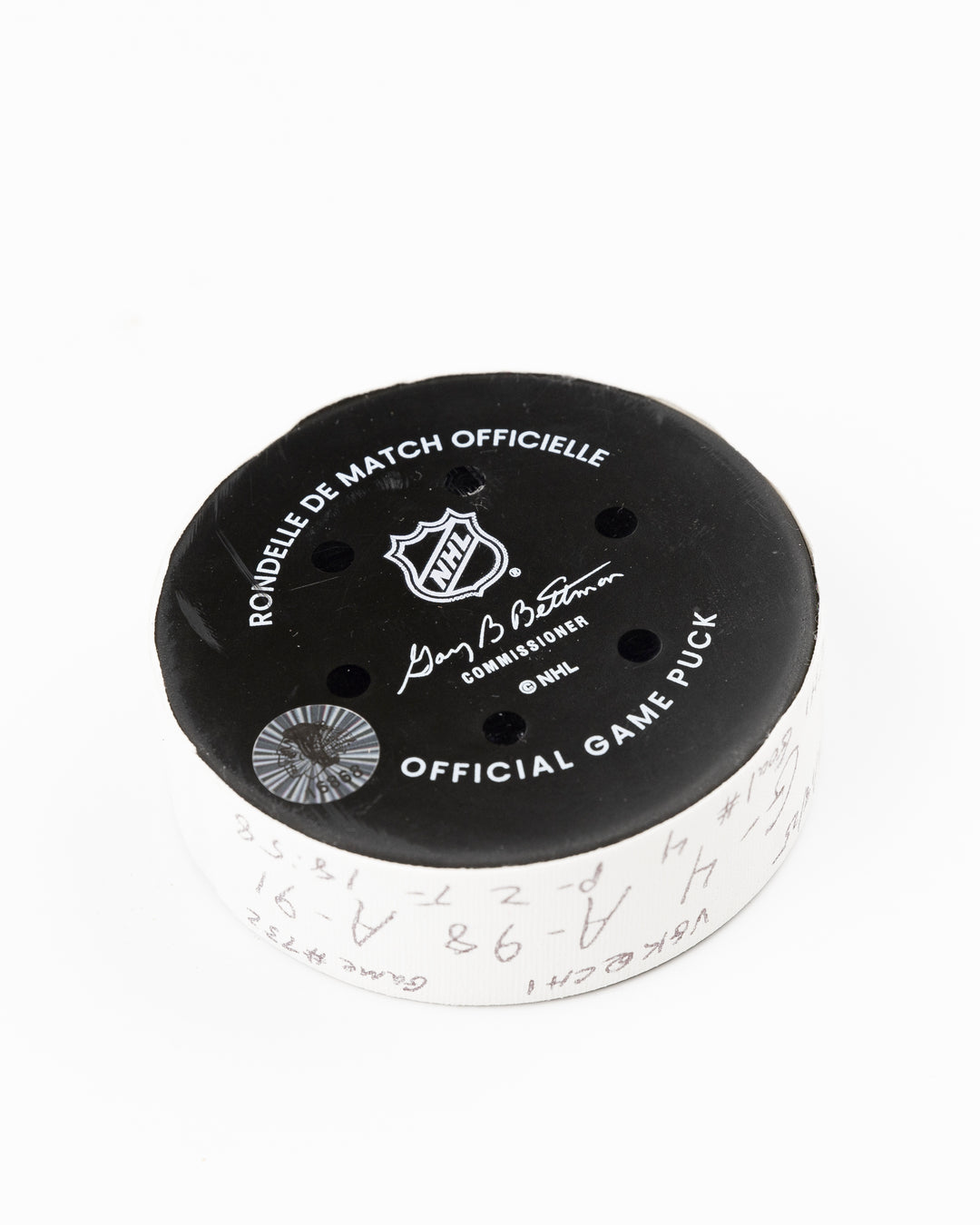 official Chicago Blackhawks game used goal hockey puck scored by Seth Jones against the Vegas Golden Knights on January 18, 2025 - back angle lay flat