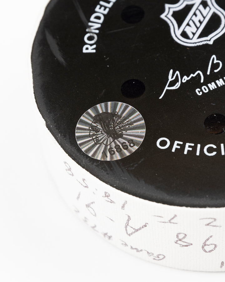 official Chicago Blackhawks game used goal hockey puck scored by Seth Jones against the Vegas Golden Knights on January 18, 2025 - hologram sticker detail lay flat