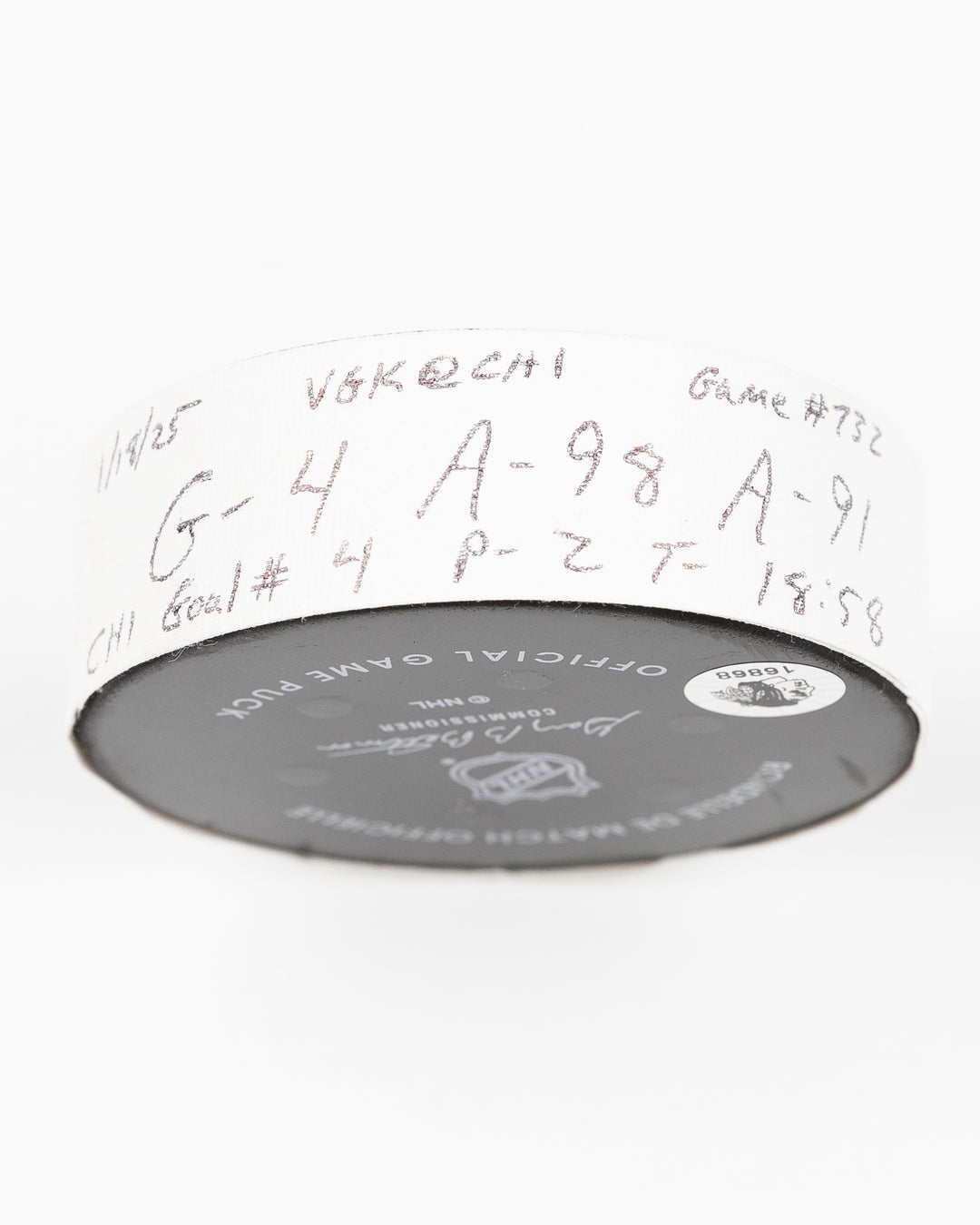 official Chicago Blackhawks game used goal hockey puck scored by Seth Jones against the Vegas Golden Knights on January 18, 2025 - tape detail lay flat
