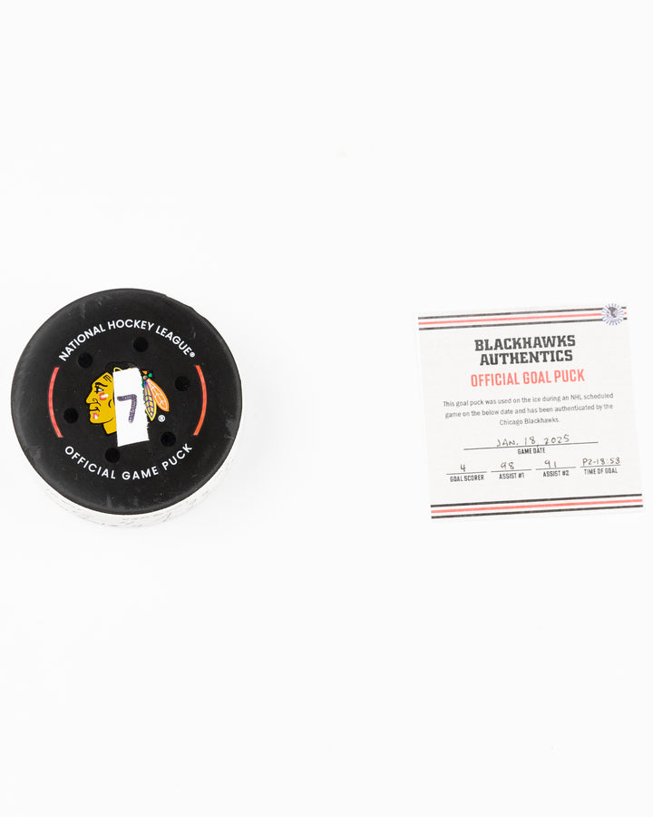 official Chicago Blackhawks game used goal hockey puck scored by Seth Jones against the Vegas Golden Knights on January 18, 2025 - front lay flat puck and certificate