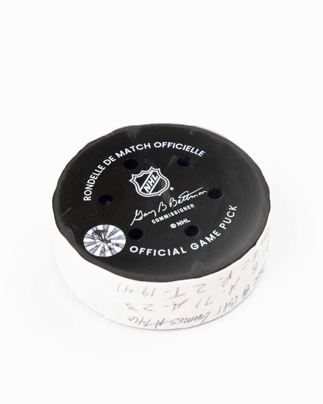 official Chicago Blackhawks game used goal puck scored by Ryan Donato against the Carolina Hurricanes on January 20, 2025 - back angle lay flat
