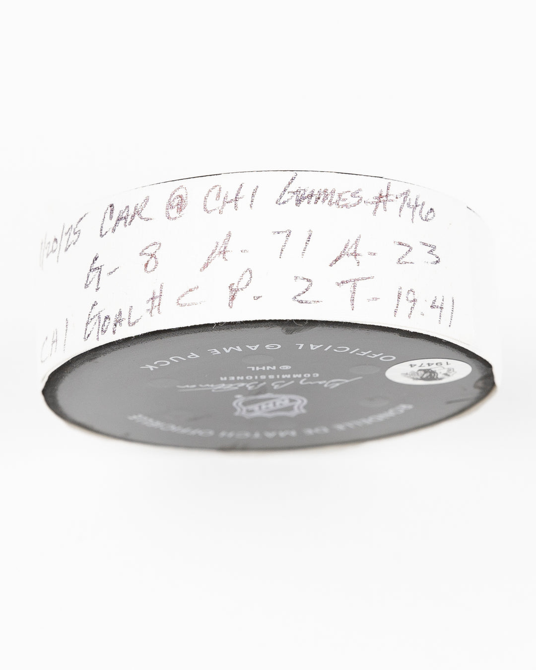 official Chicago Blackhawks game used goal puck scored by Ryan Donato against the Carolina Hurricanes on January 20, 2025 - tape detail lay flat