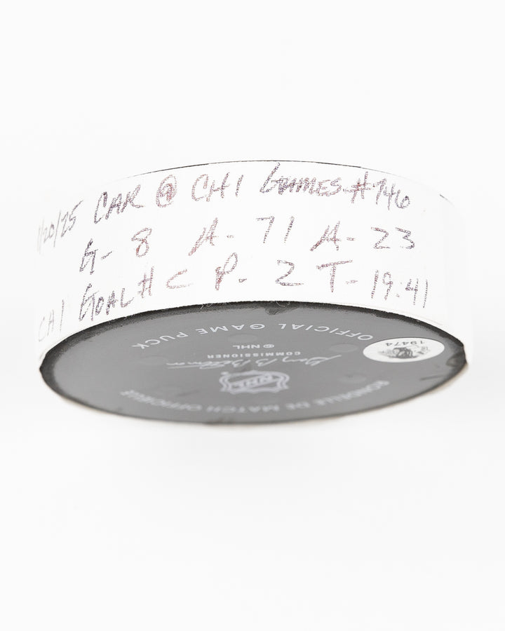 official Chicago Blackhawks game used goal puck scored by Ryan Donato against the Carolina Hurricanes on January 20, 2025 - tape detail lay flat
