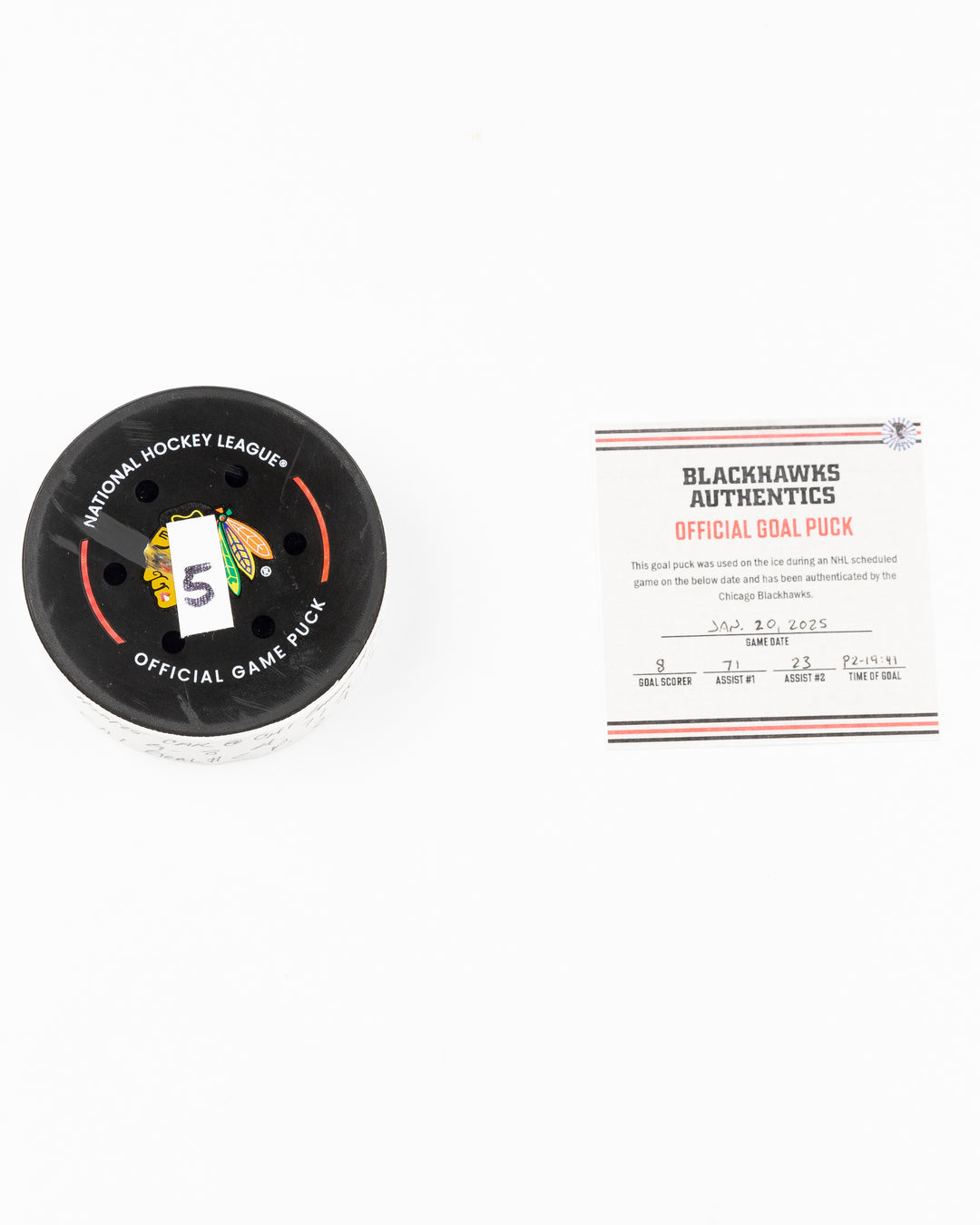 official Chicago Blackhawks game used goal puck scored by Ryan Donato against the Carolina Hurricanes on January 20, 2025 - front lay flat of puck and certificate