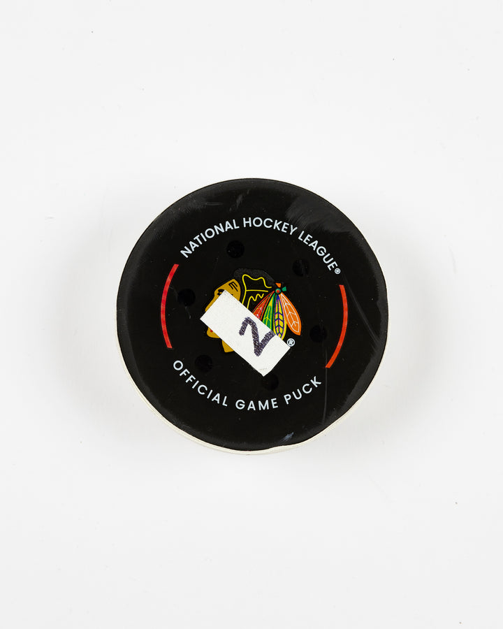official Chicago Blackhawks game-used goal puck scored by Lukas Reichel on February 5, 2025 - front lay flat