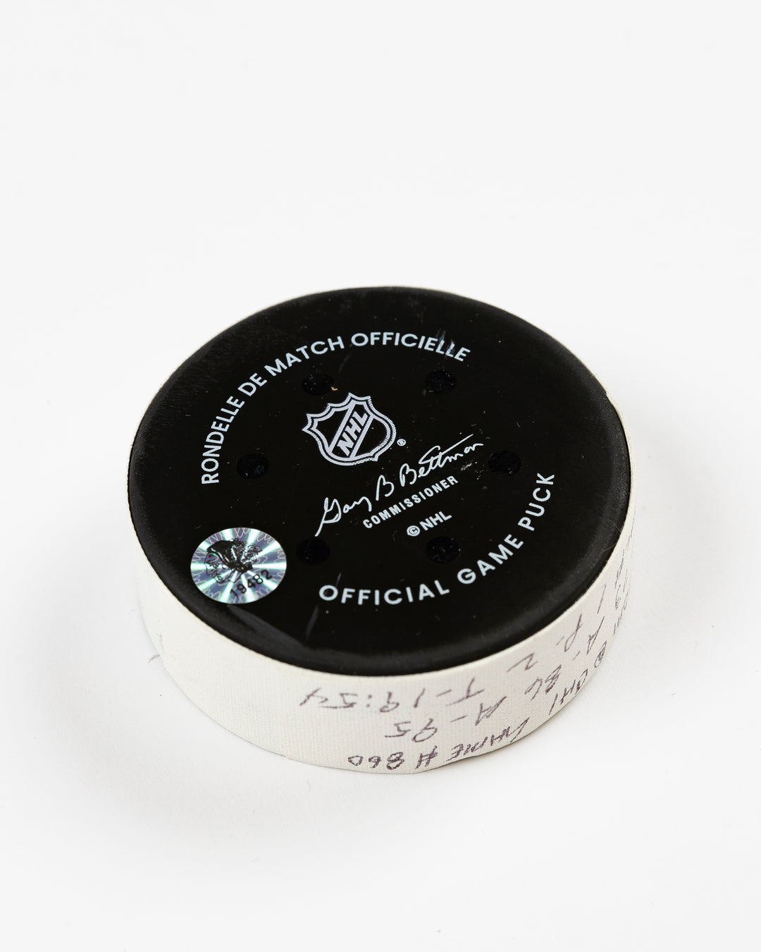 official Chicago Blackhawks game-used goal puck scored by Lukas Reichel on February 5, 2025 - back angle lay flat