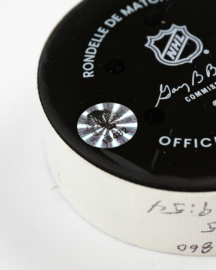 official Chicago Blackhawks game-used goal puck scored by Lukas Reichel on February 5, 2025 - hologram sticker detail lay flat