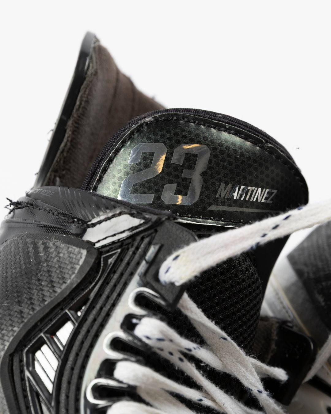 Bauer brand hockey skates game worn and used by Chicago Blackhawks player Alec Martinez - name and number detail lay flat