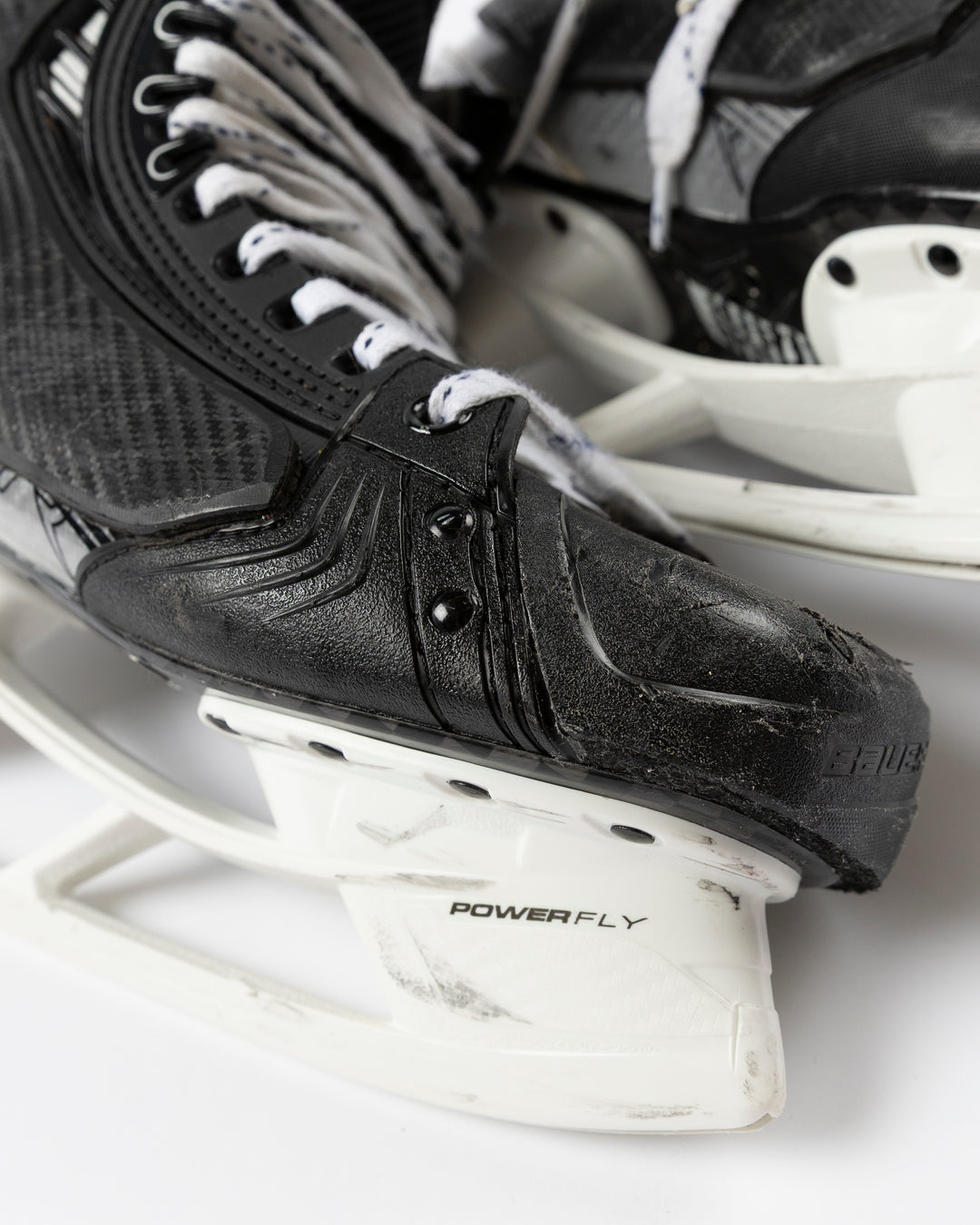 Bauer brand hockey skates game worn and used by Chicago Blackhawks player Alec Martinez - tip detail lay flat