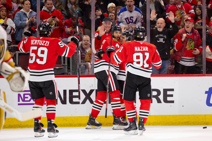 Chicago Blackhawks players Bertuzzi, Jones, Bedard and Nazar celebrating Jones goal against Vegas Golden Knights on January 18, 2025