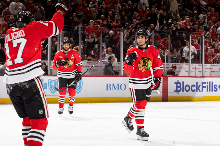 Chicago Blackhawks players Foligno, Jones and Kaiser celebrating Foligno goal against Montreal Canadiens on January 3, 2025