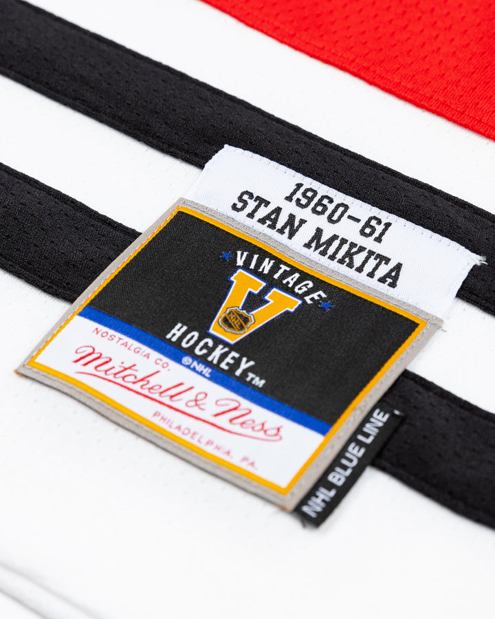 red Mitchell &amp; Ness youth throwback Stan Mikita jersey - tag detail lay flat