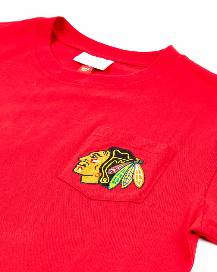 red Mitchell &amp; Ness short sleeve tee with Chicago Blackhawks primary logo on left chest pocket - front detail lay flat