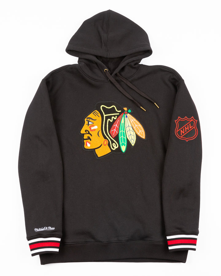 black Mitchell &amp; Ness hoodie with chainstitch Chicago Blackhawks primary logo on front and ribbed cuffs - front lay flat