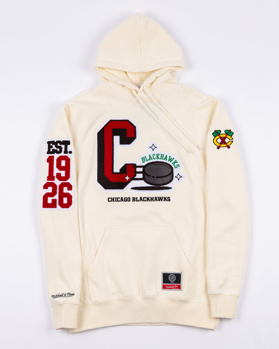 cream Mitchell & Ness hoodie with Chicago Blackhawks C and puck graphic embroidered on front with est. 1926 embroidered on right sleeve and secondary logo on left sleeve - front lay flat