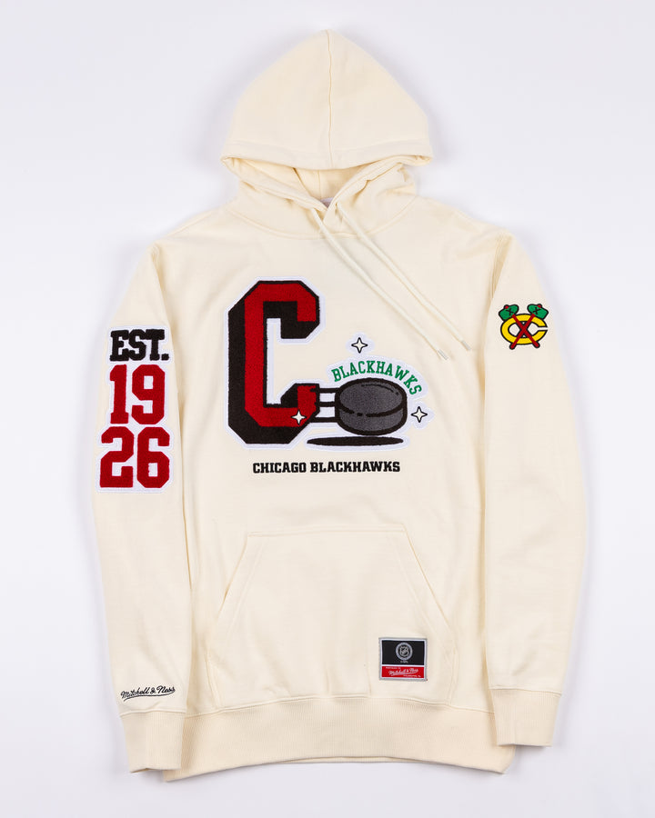 cream Mitchell &amp; Ness hoodie with Chicago Blackhawks C and puck graphic embroidered on front with est. 1926 embroidered on right sleeve and secondary logo on left sleeve - front lay flat