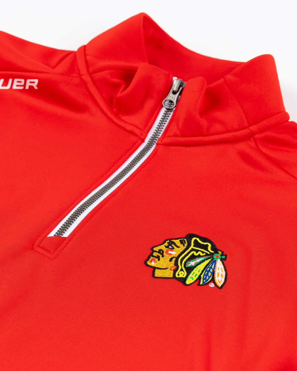 red Bauer half zip with Chicago Blackhawks primary logo embroidered on left chest - front detail lay flat