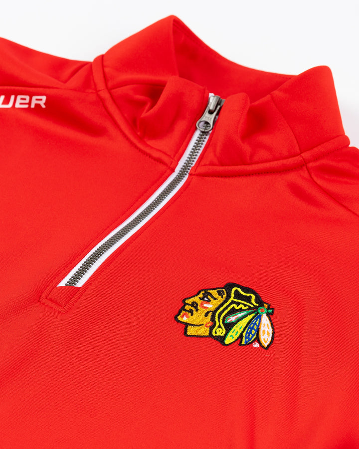 red Bauer half zip with Chicago Blackhawks primary logo embroidered on left chest - front detail lay flat