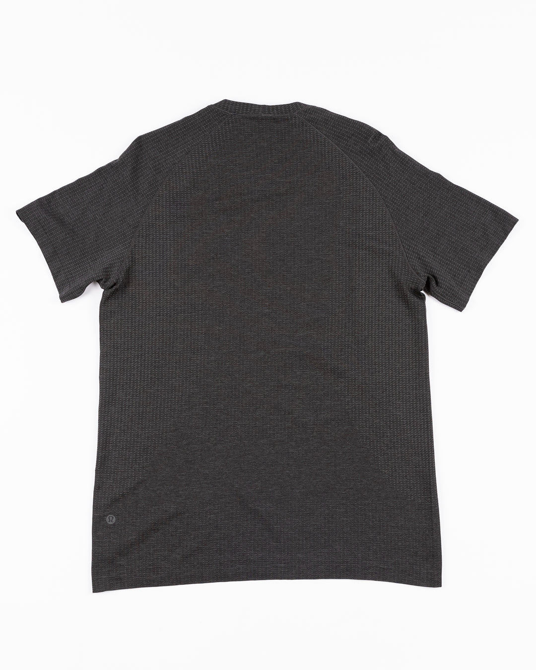 black lululemon short sleeve tee with Chicago Blackhawks wordmark across front - back lay flat