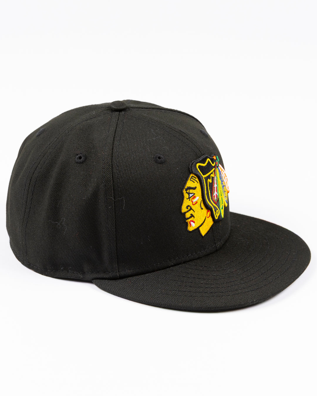 black New Era fitted 59FIFTY hat with embroidered Chicago Blackhawks primary logo on front and secondary logo on back - right angle lay flat