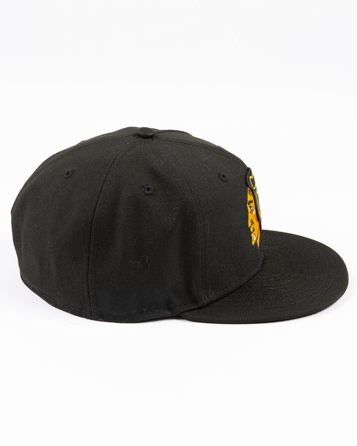 black New Era fitted 59FIFTY hat with embroidered Chicago Blackhawks primary logo on front and secondary logo on back - right side lay flat