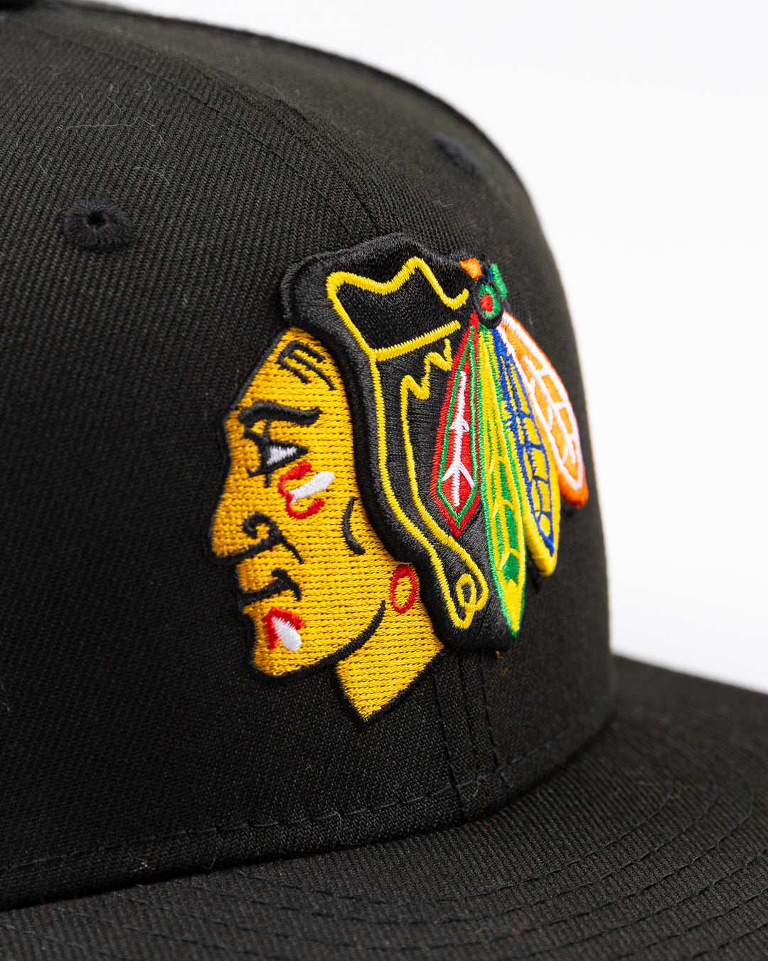 black New Era fitted 59FIFTY hat with embroidered Chicago Blackhawks primary logo on front and secondary logo on back - front detail lay flat